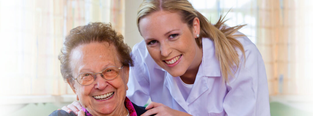 Professional-Home-Care-Services-Milwaukee-Caregiver-Senior A friendly caregiver smiling with an elderly woman, representing the compassionate home health care provided by Professional Home Care Services in Milwaukee.