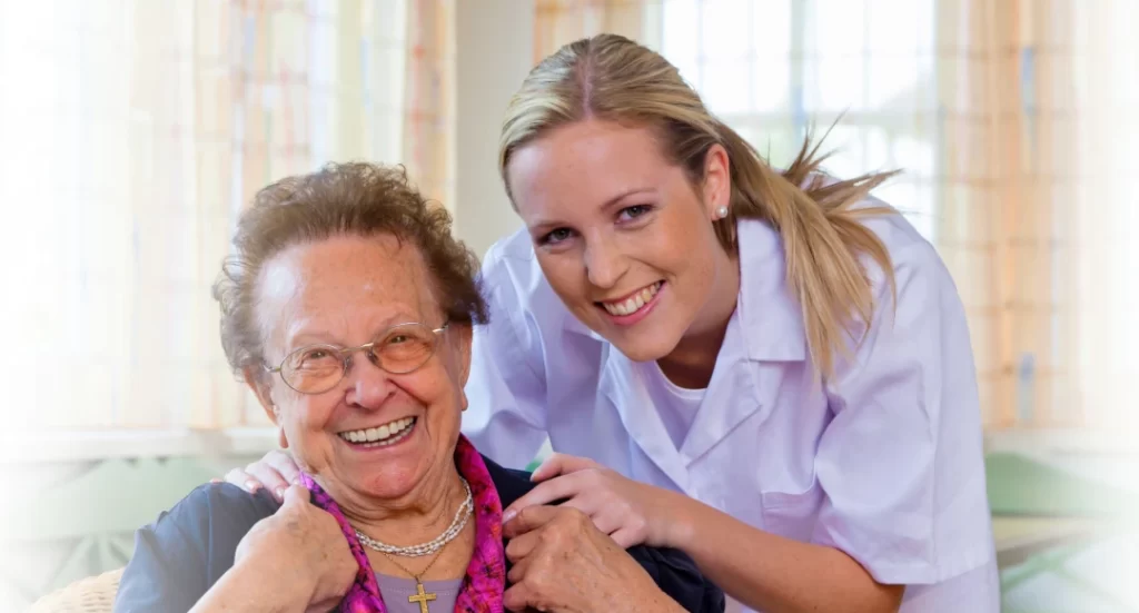 A friendly caregiver from Professional Home Care Services smiling with an elderly woman, providing compassionate home health care in Milwaukee, WI.